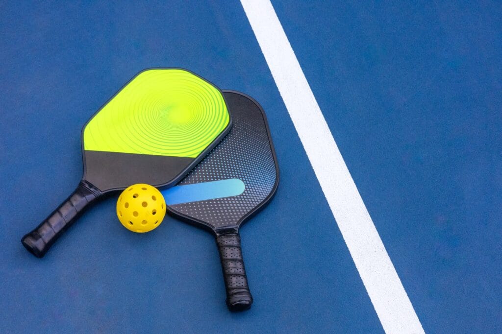 Home 33 Pickleball Racquet's on blue court